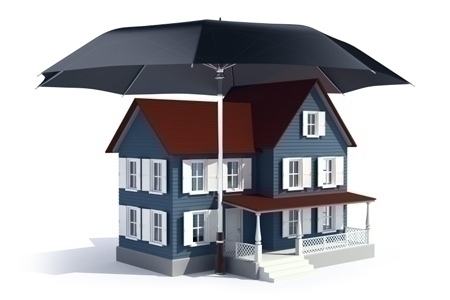 Insurance concept -  house under umbrella