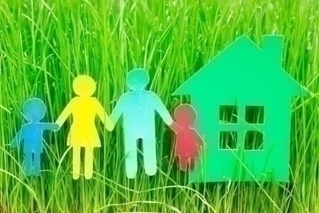 Paper family and house  in grass