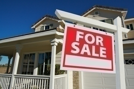 Sold Home For Sale Sign & New House