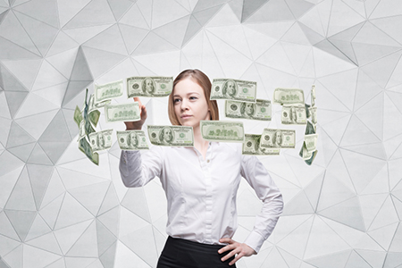 Young lady is controlling cash flow of the dollar notes. Contemporary background.