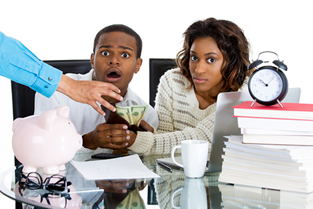 young couple trying to save their piggy bank