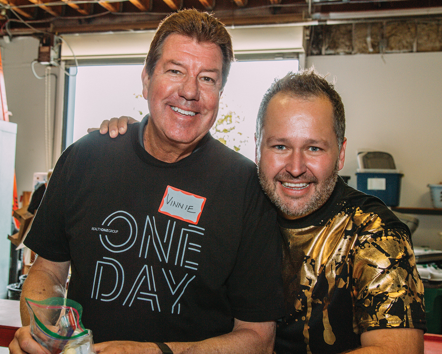 Jewgieniew and Realty ONE Group Affiliates President Vinnie Tracey at ONE Day, the firm's national day of giving back, held annually on May 1.