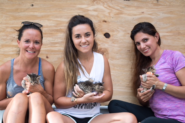 (L to R) Mother/daughter volunteers Susan Roadman and Mallory Pachtman; and Samira Davis, agent with Coldwell Banker Sea Coast Advantage and founder of Sea Coast Pet Sanctuary