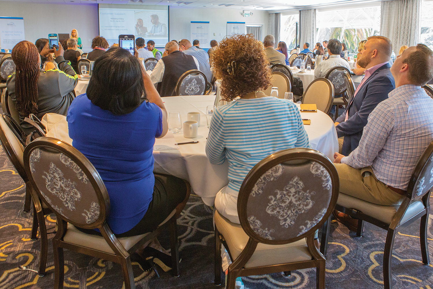 Real estate professionals attend a Bridge Listing Input launch event.