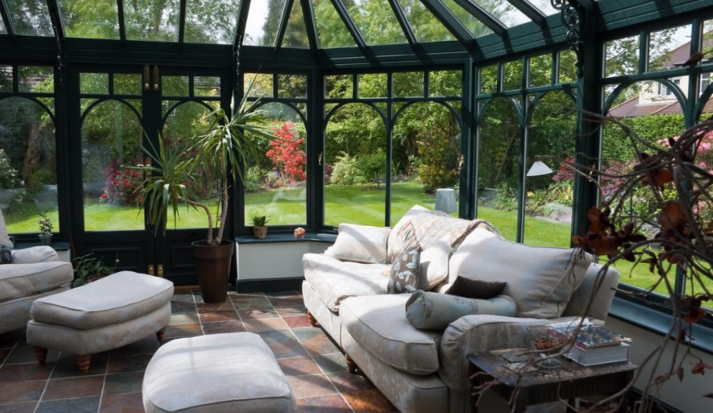 englishconservatorysunroomwithmodernfurniturepictureid157484148