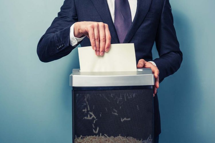 Berkshire Hathaway HomeServices Florida Holding Shredding for Charity Event