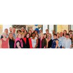 Alcorn (center, in red) at an awards ceremony for LAER's Florida Office