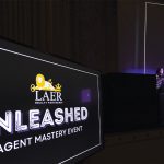 Alcorn speaking at the company's agent mastery event, "Unleashed."