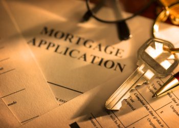 A house key sitting on mortgage application.To see more of my financial images click on the link below: