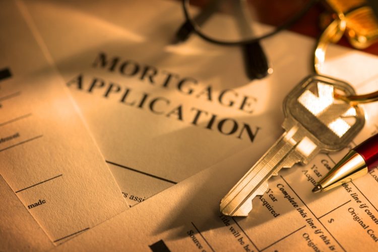A house key sitting on mortgage application.To see more of my financial images click on the link below: