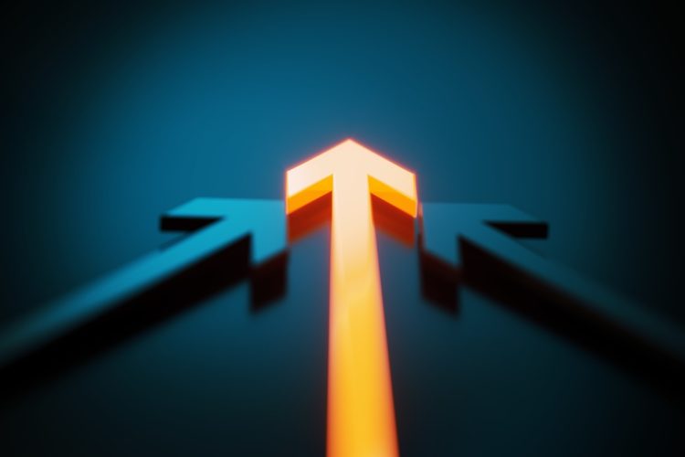 Two arrow symbols following an orange colored arrow symbol on dark blue background. Horizontal composition.