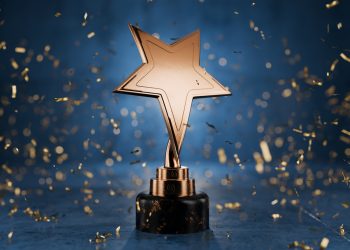 Gold star on a blue background as a reward. Top Performance Award. Winners Cup. Achievements. Victory. Goal achievement concept. Winner certificate. First place in a computer game. 3D rendering.