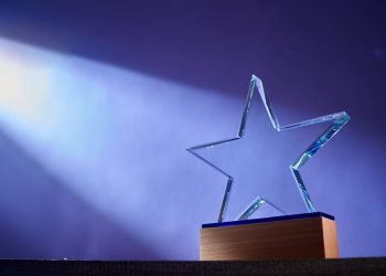 star shape of crystal trophy against purple background