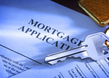 A house key sitting on mortgage application.To see more of my financial images click on the link below: