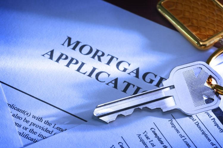 A house key sitting on mortgage application.To see more of my financial images click on the link below: