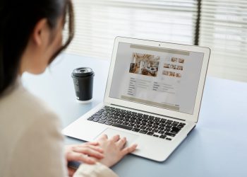 Asian women viewing real estate websites on a computer
